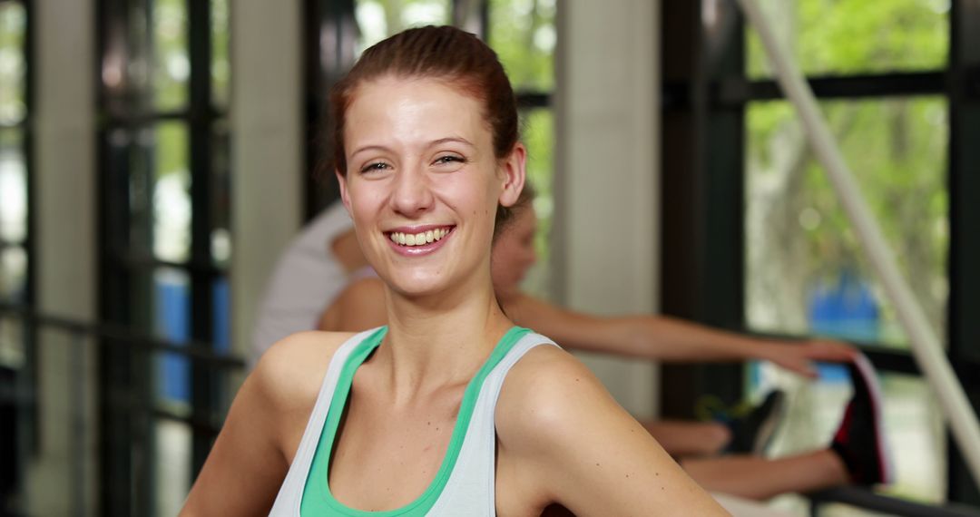 Smiling Woman in Gym Wearing Sportswear - Free Images, Stock Photos and Pictures on Pikwizard.com