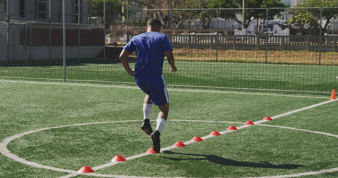 Soccer Player Training with Cones on Artificial Turf Field - Free Images, Stock Photos and Pictures on Pikwizard.com