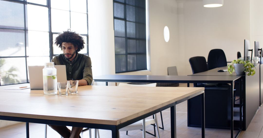 Young Professional Working in Modern Empty Office Space
