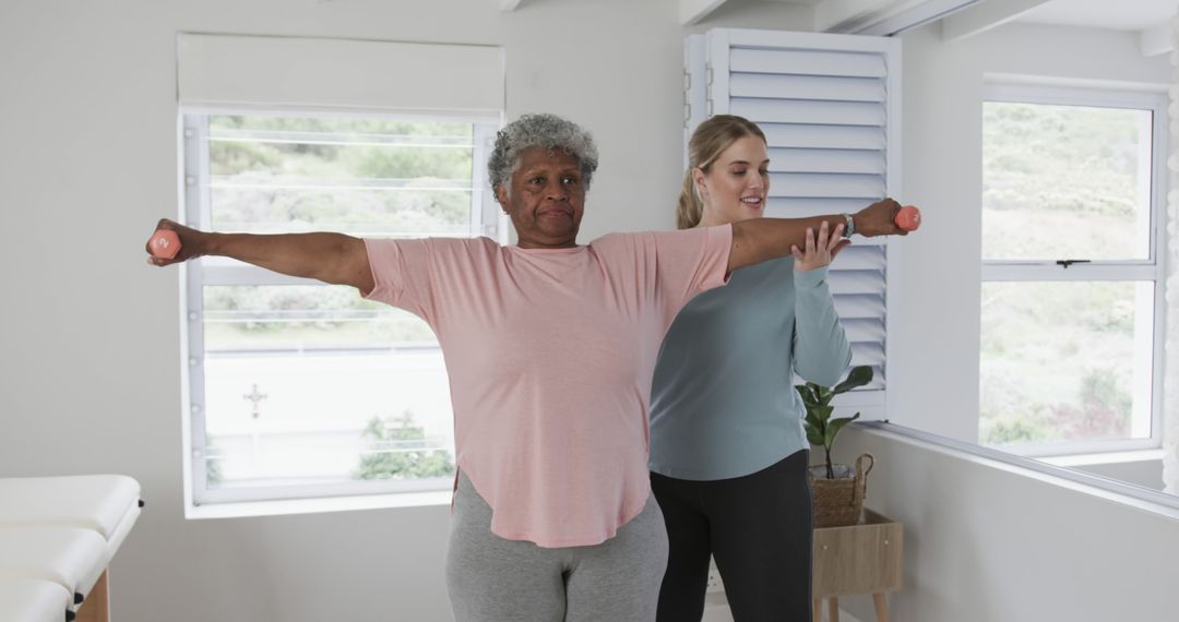 Senior Woman Exercising with Trainer at Home - Free Images, Stock Photos and Pictures on Pikwizard.com