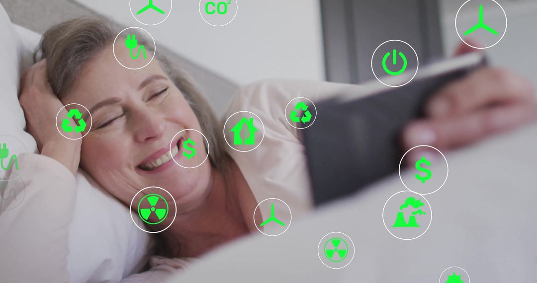Senior Woman Relaxing in Bedroom While Using Eco-Friendly Technology on Tablet