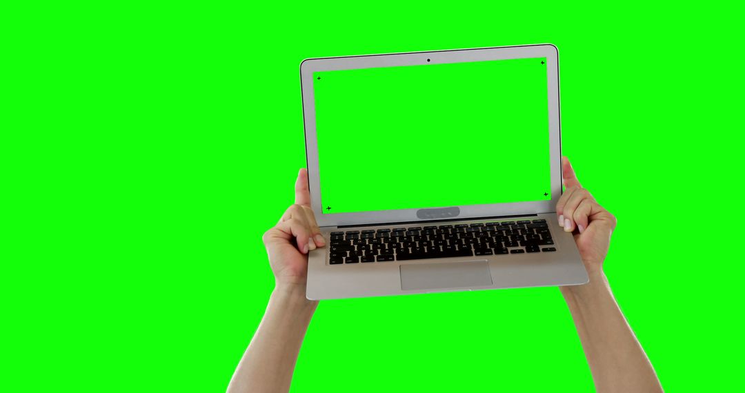 Hands holding laptop with green screen, isolated on green background - Free Images, Stock Photos and Pictures on Pikwizard.com