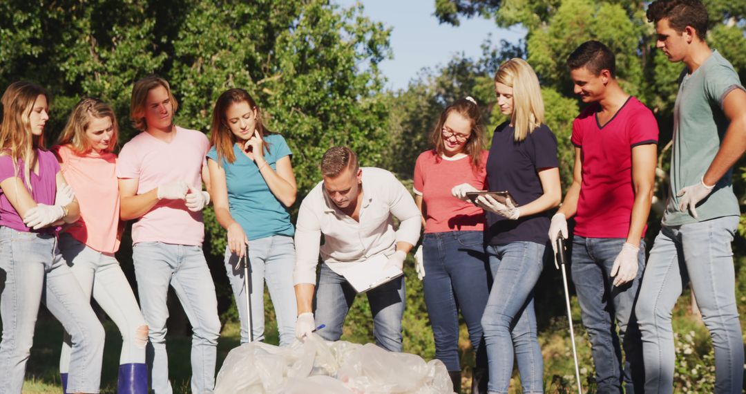 Group of Volunteers Collecting Trash in Park - Free Images, Stock Photos and Pictures on Pikwizard.com