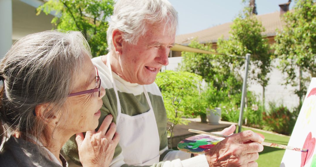 Seniors Enjoying Outdoor Painting Together on Sunny Day - Free Images, Stock Photos and Pictures on Pikwizard.com