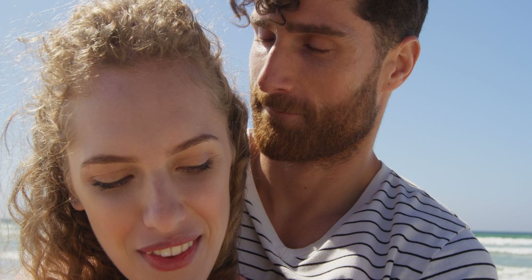 Romantic Young Couple Embracing on Beach - Free Images, Stock Photos and Pictures on Pikwizard.com