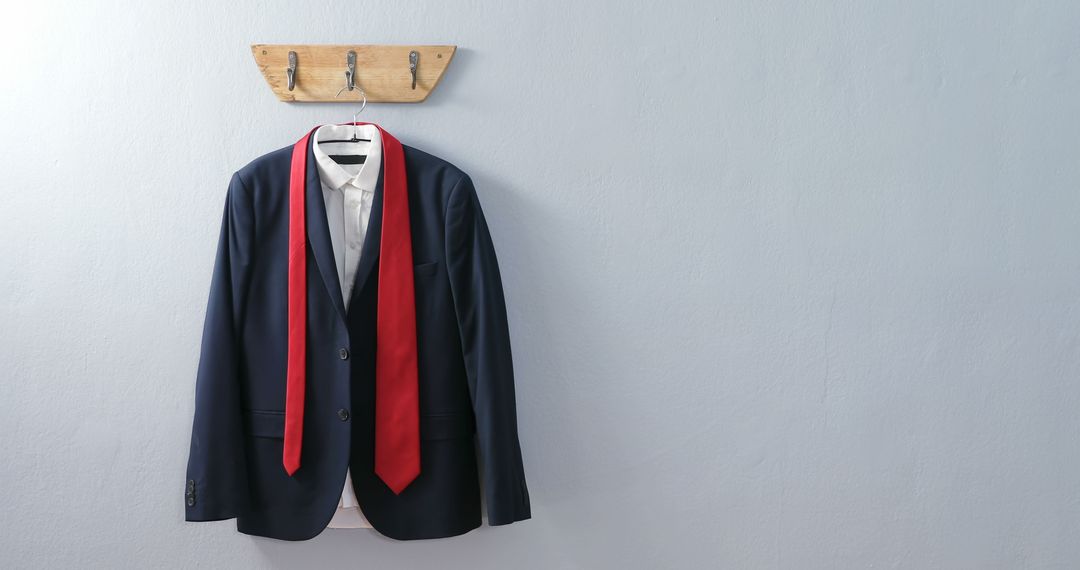 Formal Suit with Red Tie Hanging on Wooden Rack - Free Images, Stock Photos and Pictures on Pikwizard.com