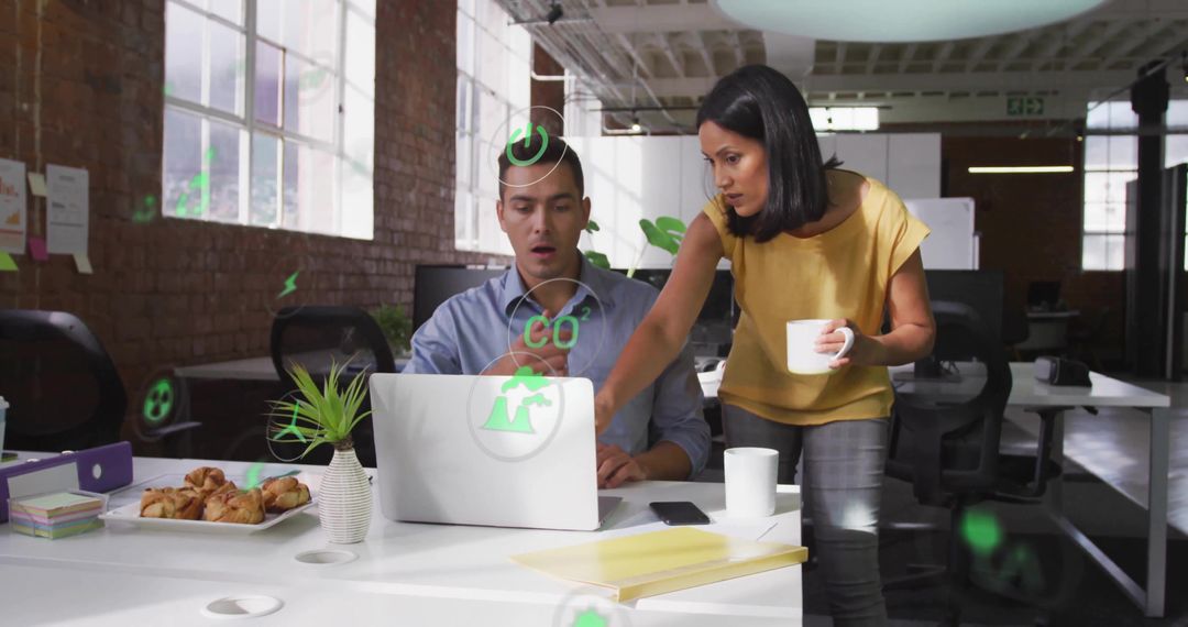 Two Colleagues Analyzing Green Icons in Loft Office