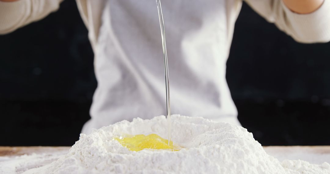 Baker Mixing Flour and Eggs Preparing Dough - Free Images, Stock Photos and Pictures on Pikwizard.com