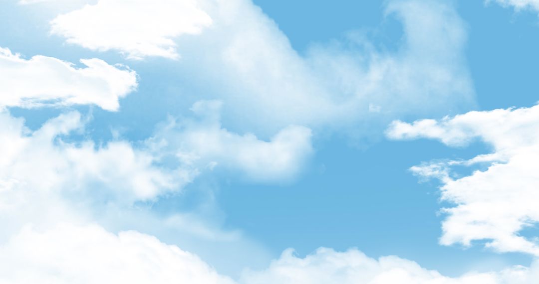 Clear Blue Sky with Fluffy White Clouds in Tranquil Setting