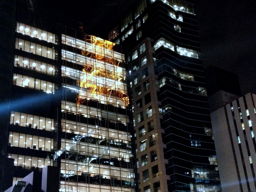 Modern Office Buildings at Night with Illuminated Windows - Free Images, Stock Photos and Pictures on Pikwizard.com