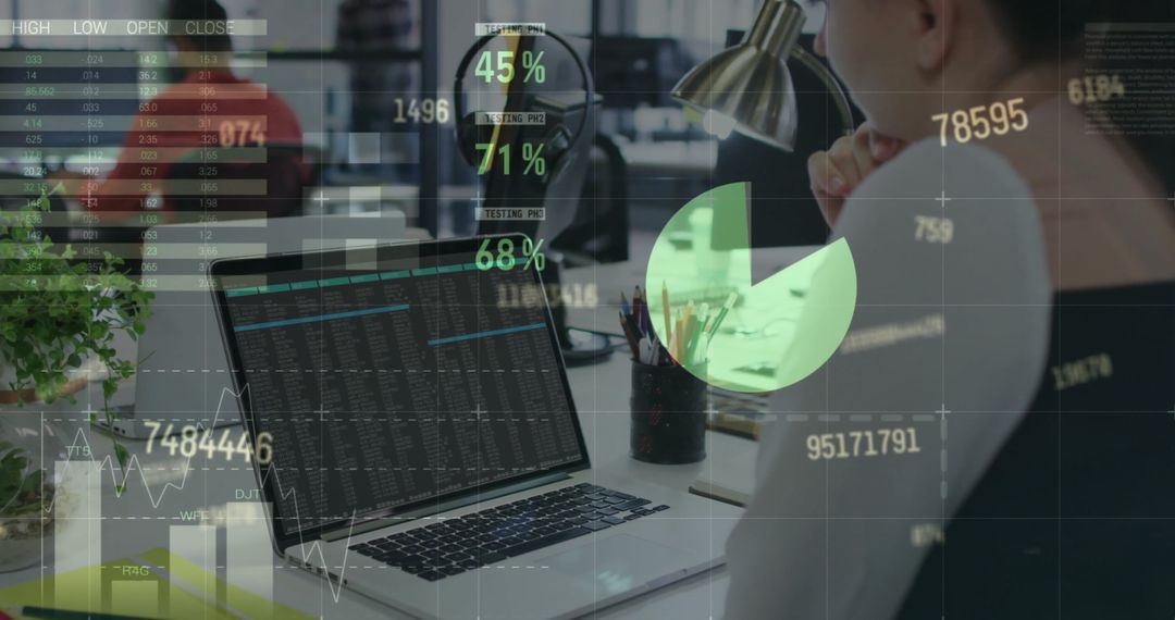 Financial Analyst Analyzing Data on Laptop in Modern Office