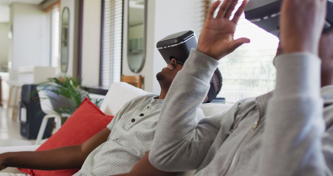 Friends Enjoying Virtual Reality Experience on Couch - Free Images, Stock Photos and Pictures on Pikwizard.com