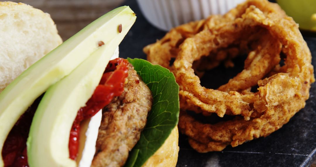 Vegetarian Burger with Avocado and Crispy Onion Rings - Free Images, Stock Photos and Pictures on Pikwizard.com