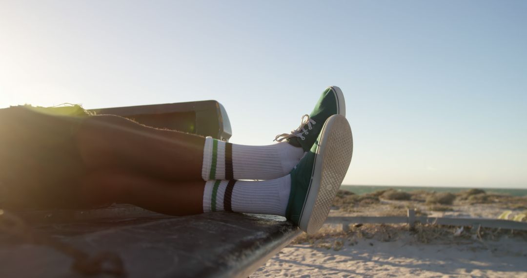 Relaxing at Beach with Green Sneakers and White Socks - Free Images, Stock Photos and Pictures on Pikwizard.com