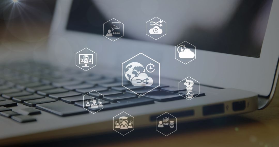 Digital Network Symbols Floating Above Laptop Keyboard