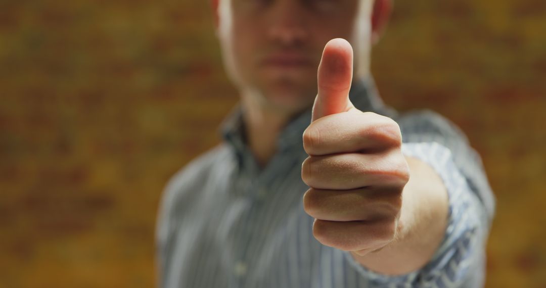 Close-Up of Man Giving Thumbs Up Gesture - Free Images, Stock Photos and Pictures on Pikwizard.com