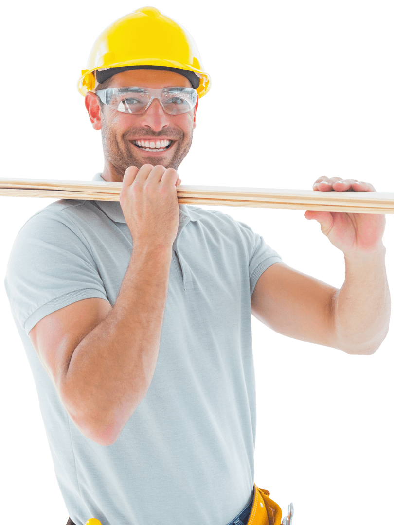 Smiling Carpenter Carrying Wooden Planks Wearing Hard Hat and Goggles