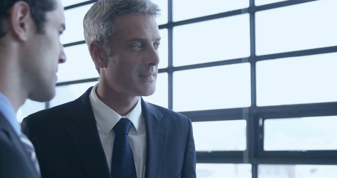 Business Professionals Collaborating in Modern Office Setup