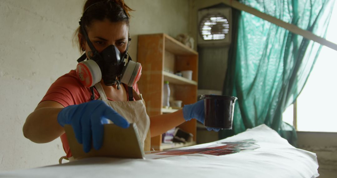 Female Artisan in Facemask Crafting Surfboard with Precision
