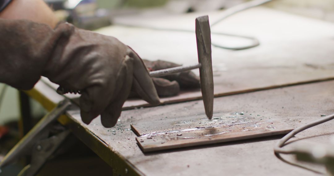 Close-Up of Craftsperson Hammering Metal in Workshop - Free Images, Stock Photos and Pictures on Pikwizard.com