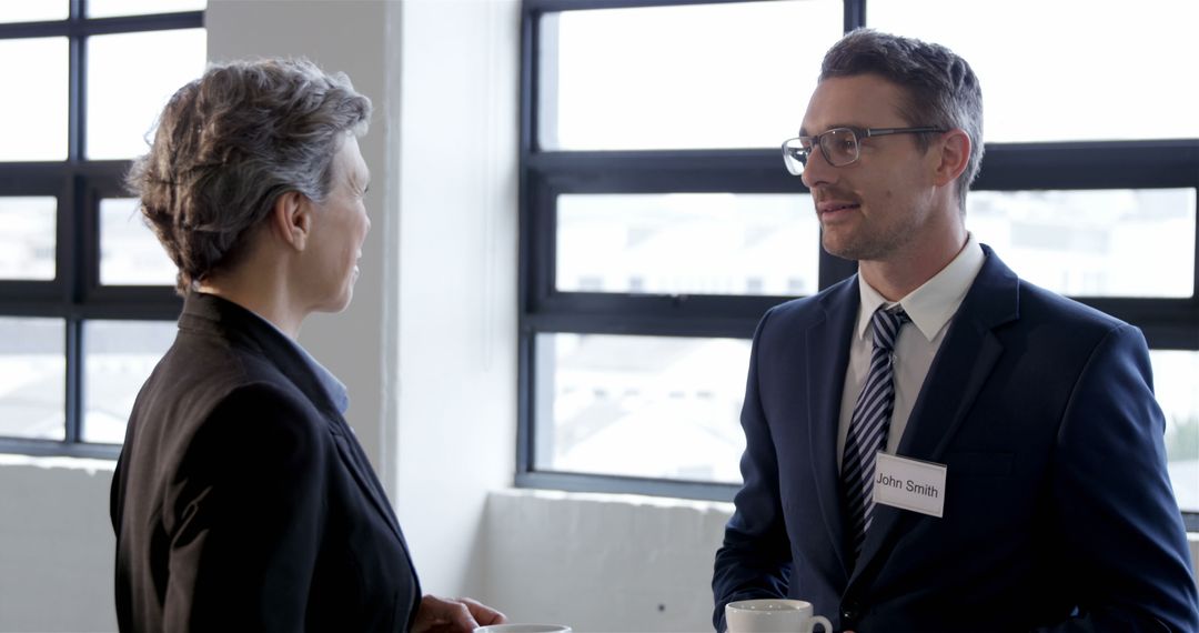 Colleagues Conversing and Having Coffee During Office Break