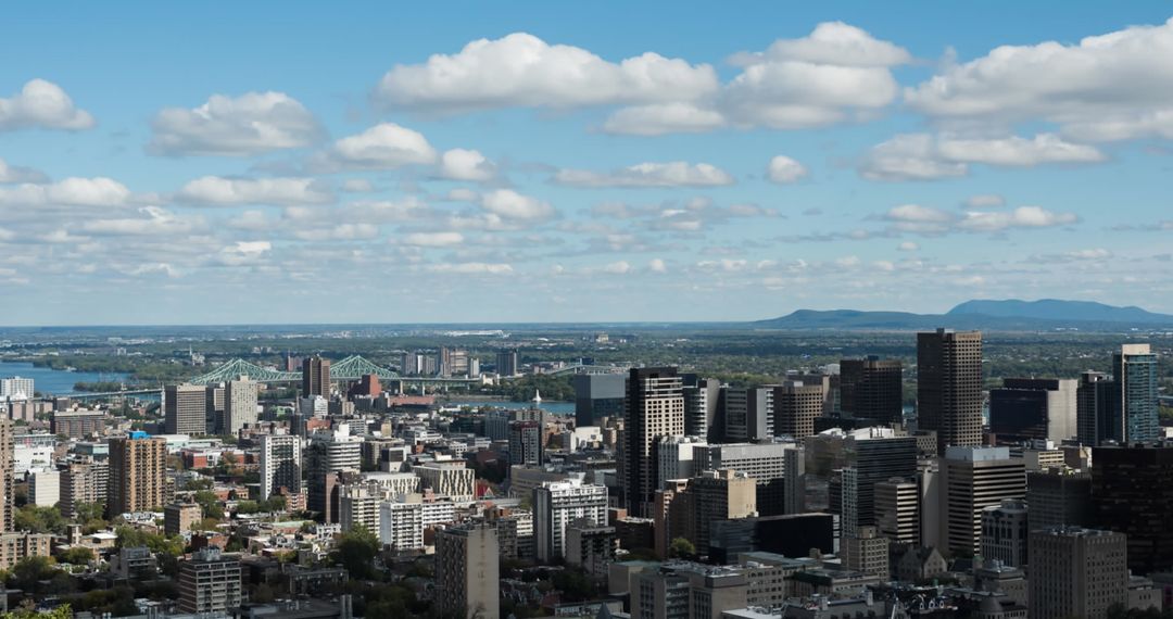 Modern Cityscape with Digital Interface Icons Under Blue Skies