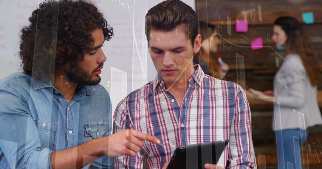 Business Professionals Analyzing Data on Tablet