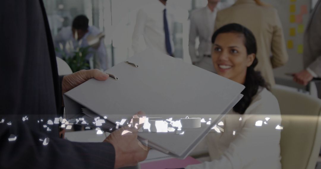 Woman Accepting Files in Team-Oriented Office Environment