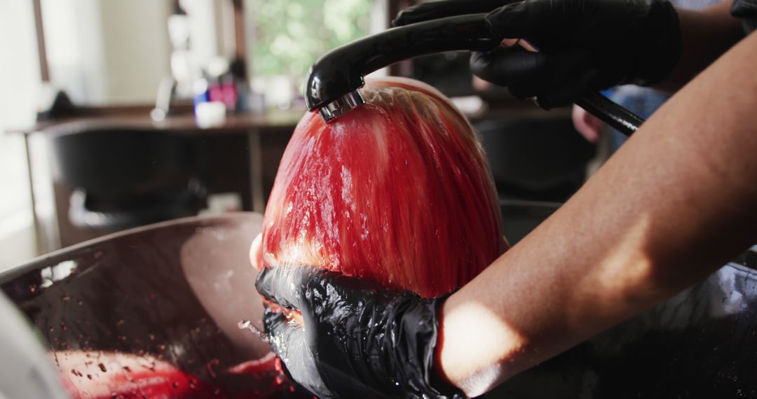 Hairdresser Rinsing Red Hair Dye from Woman's Hair at Salon - Free Images, Stock Photos and Pictures on Pikwizard.com