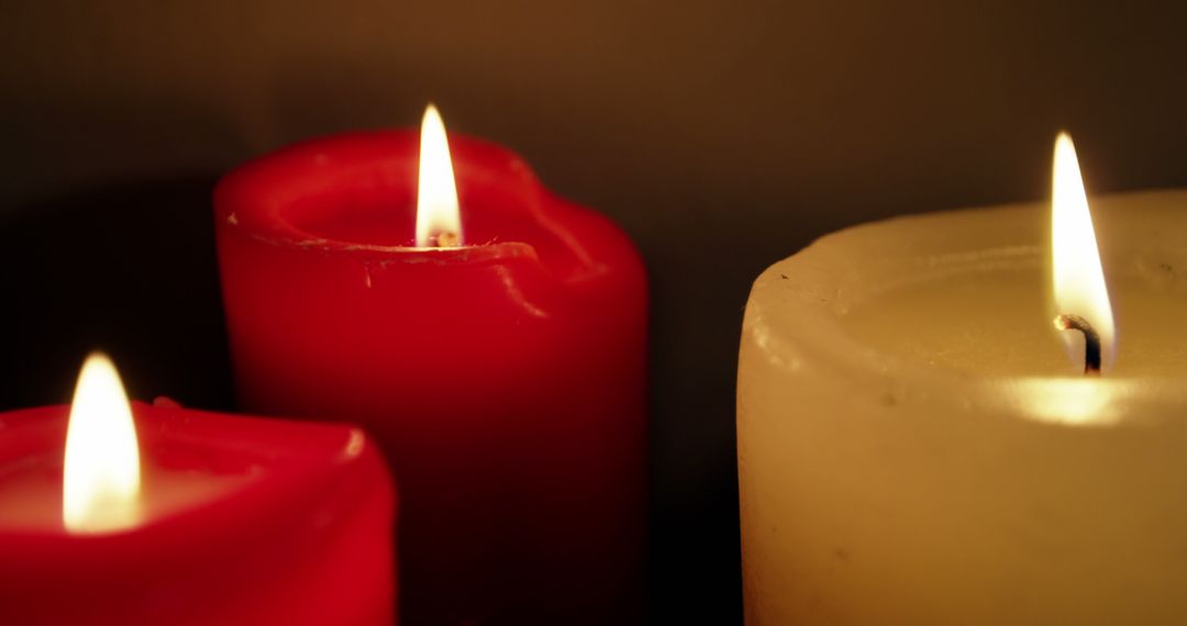 Close-Up of Lit Red and White Candles with Warm Glow - Free Images, Stock Photos and Pictures on Pikwizard.com