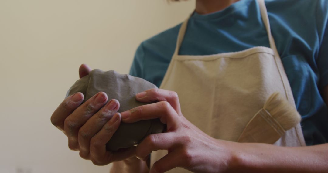 Artist Shaping Clay with Hands in Calm Setting - Free Images, Stock Photos and Pictures on Pikwizard.com