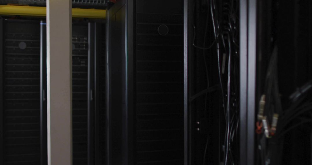 Server cabinet with networking cables in data center aisle