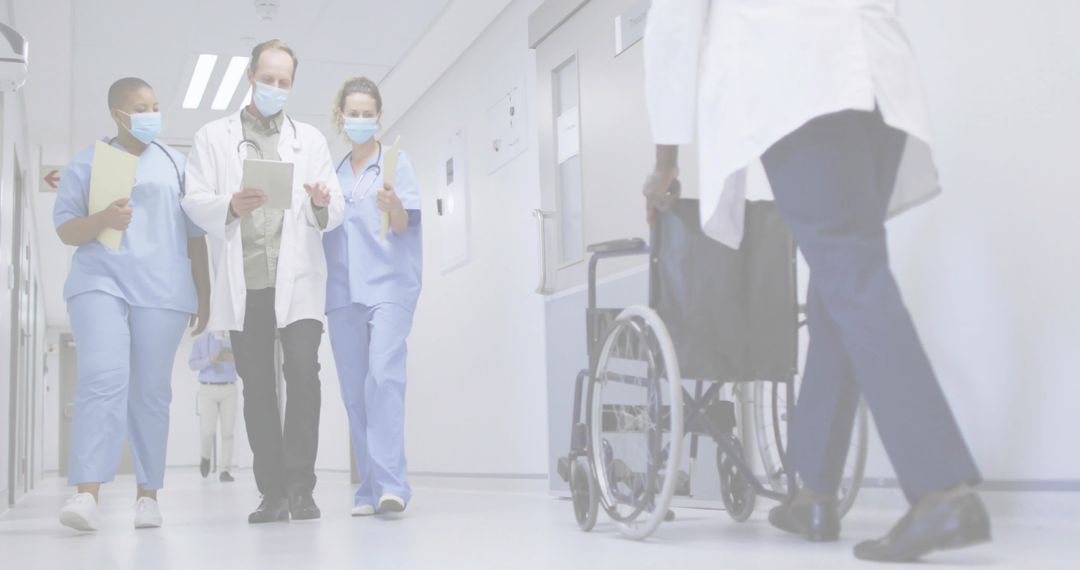 Medical Team Collaborating in Hospital Hallway with Technology