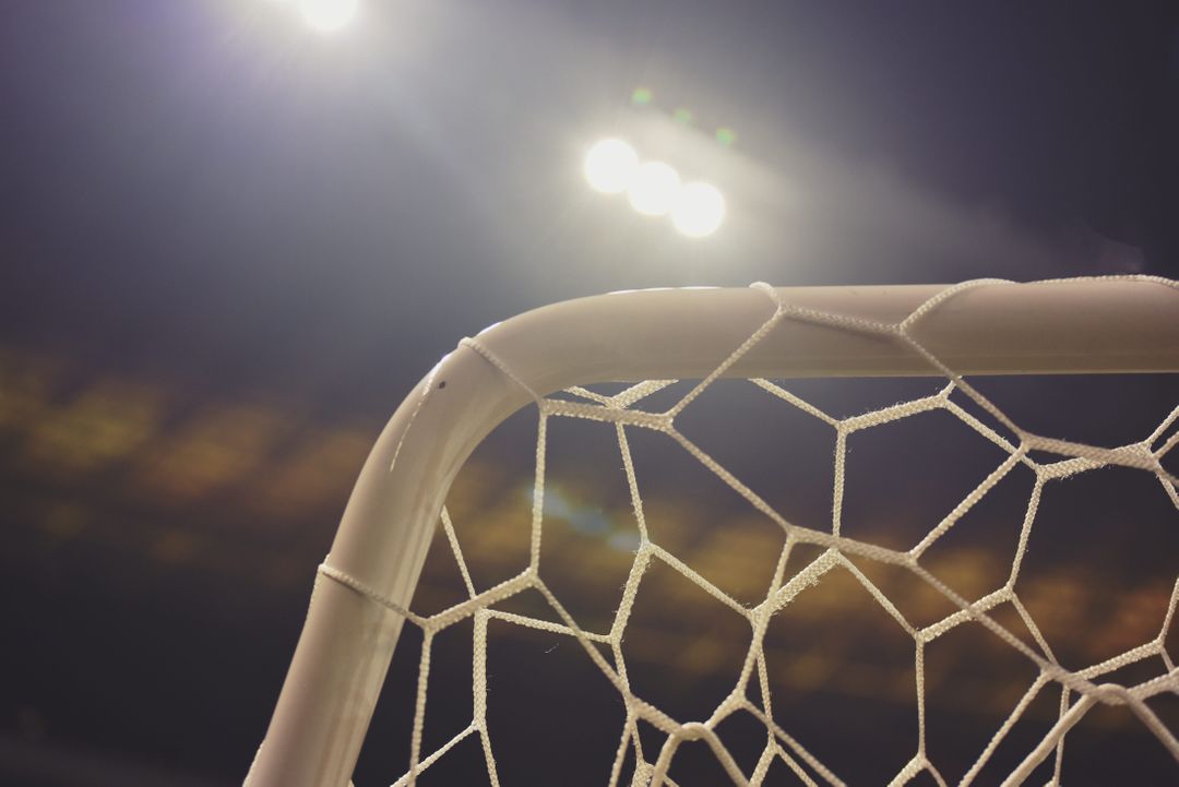 Close-Up of Soccer Goal Net Under Stadium Lights - Free Images, Stock Photos and Pictures on Pikwizard.com