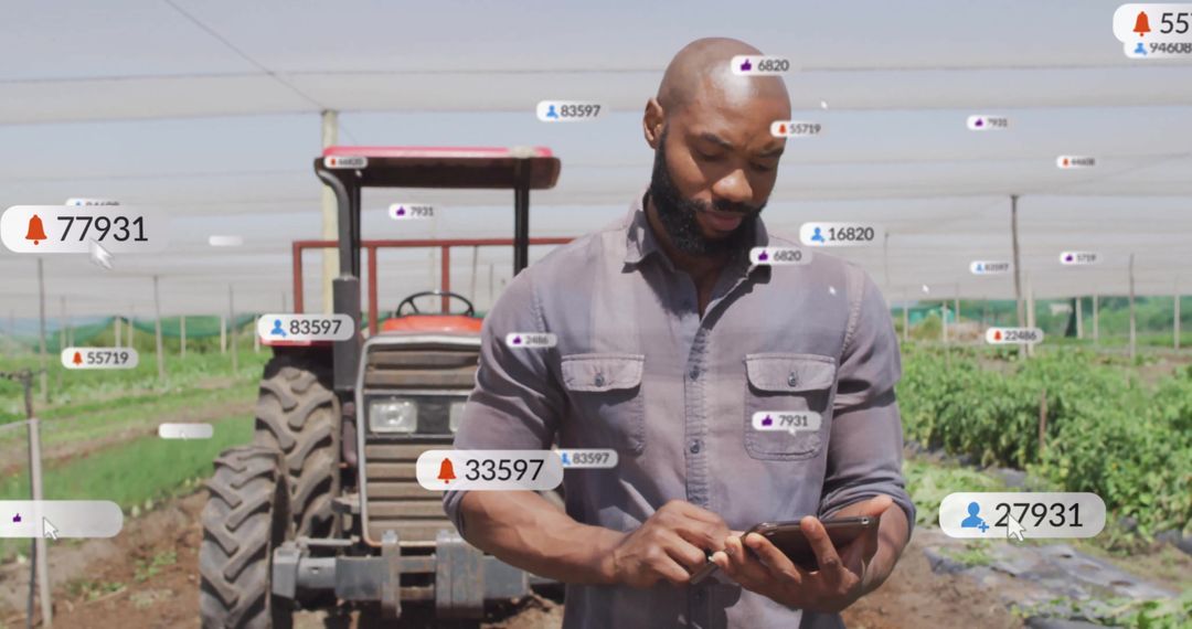 Farmer Monitoring Notifications on Tablet in Agricultural Field
