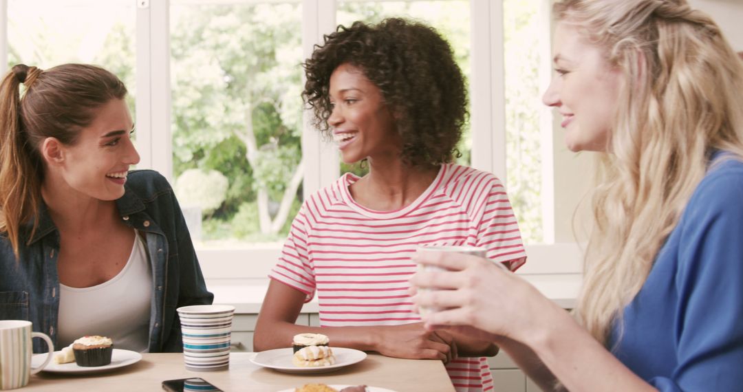 Diverse Young Women Enjoying Coffee and Pastries at Home - Free Images, Stock Photos and Pictures on Pikwizard.com