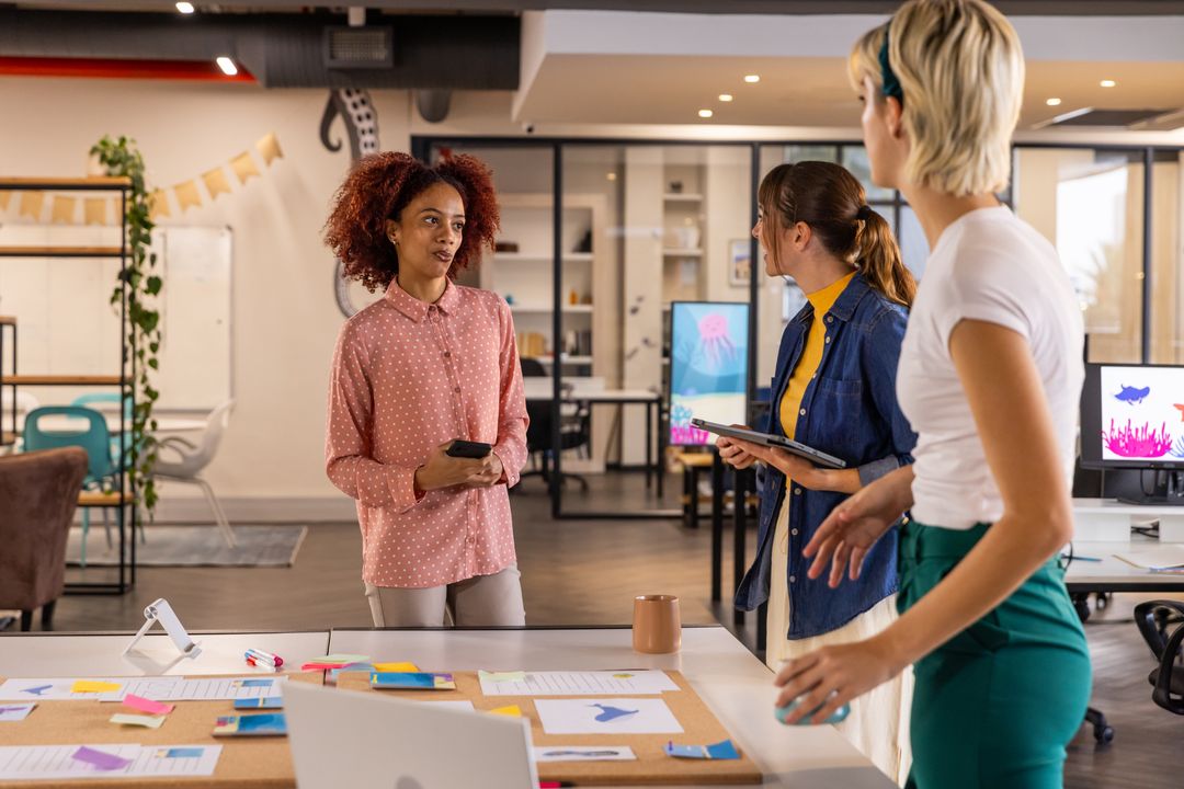Diverse Female Team Collaborating in Modern Open Office