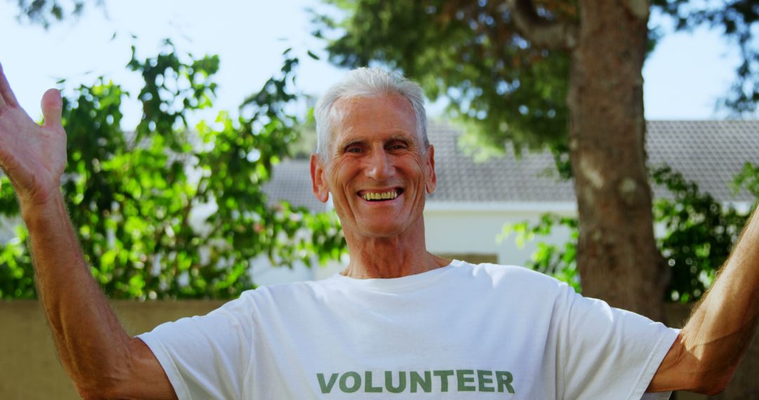 Smiling Elderly Volunteer in Outdoor Environment - Free Images, Stock Photos and Pictures on Pikwizard.com