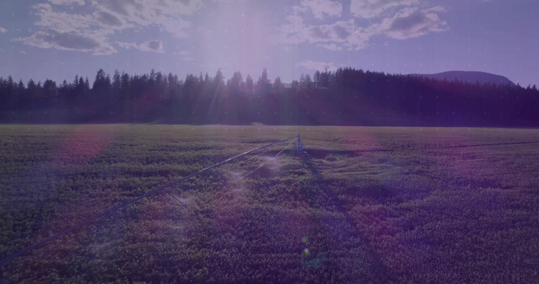 Sunlit Irrigation System Casting Long Shadows on Farmland
