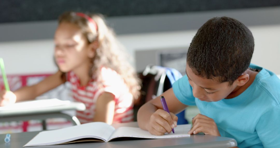 Children Studying and Taking Notes in Classroom