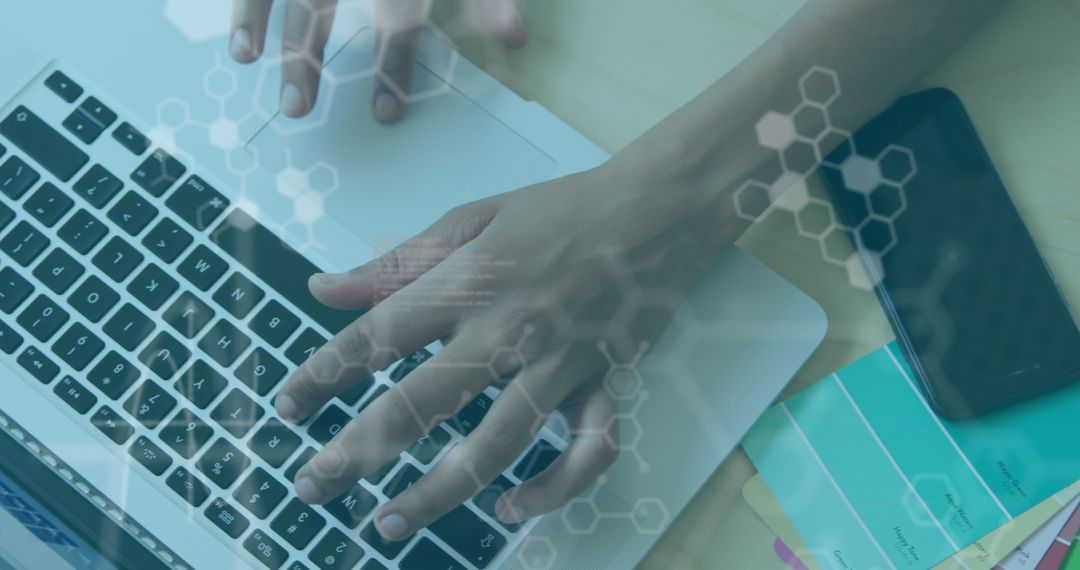 Hands on Laptop Typing with Technology Overlay on Desk