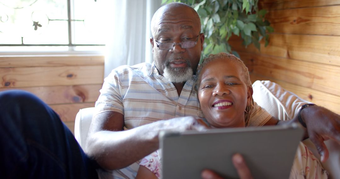 Senior Couple Enjoying Video Call on Digital Tablet Together