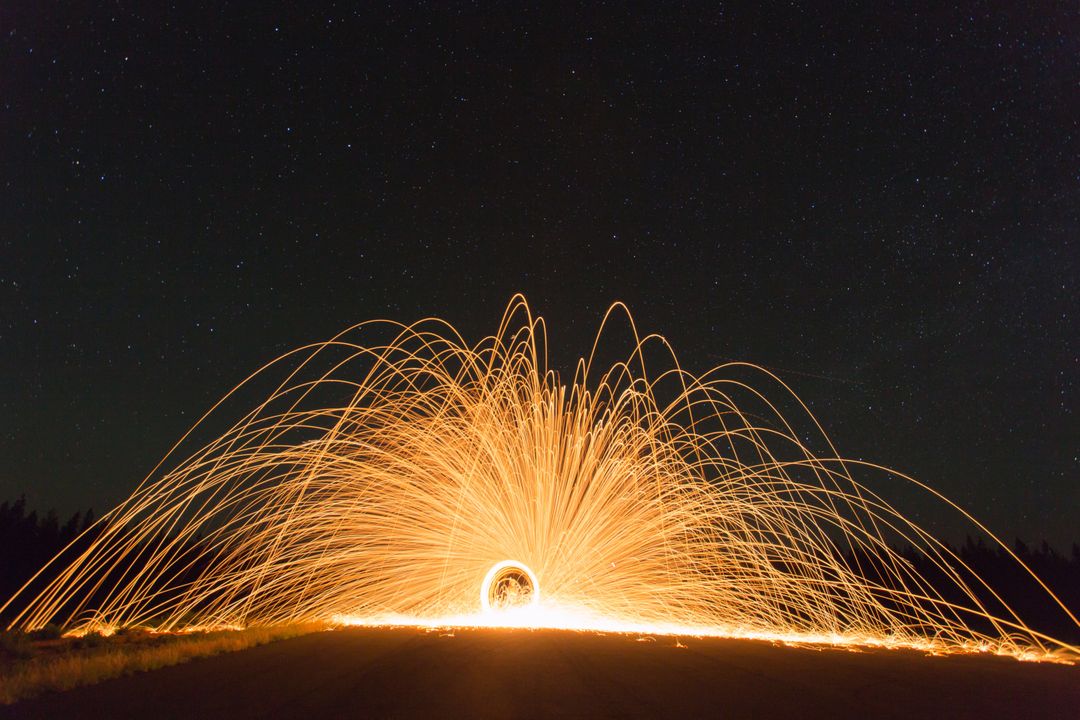 Long Exposure Steel Wool Photography under Starry Night Sky - Free Images, Stock Photos and Pictures on Pikwizard.com
