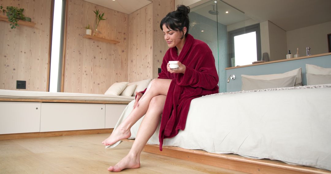Woman Relaxing with Coffee in Minimalist Modern Bedroom Setting