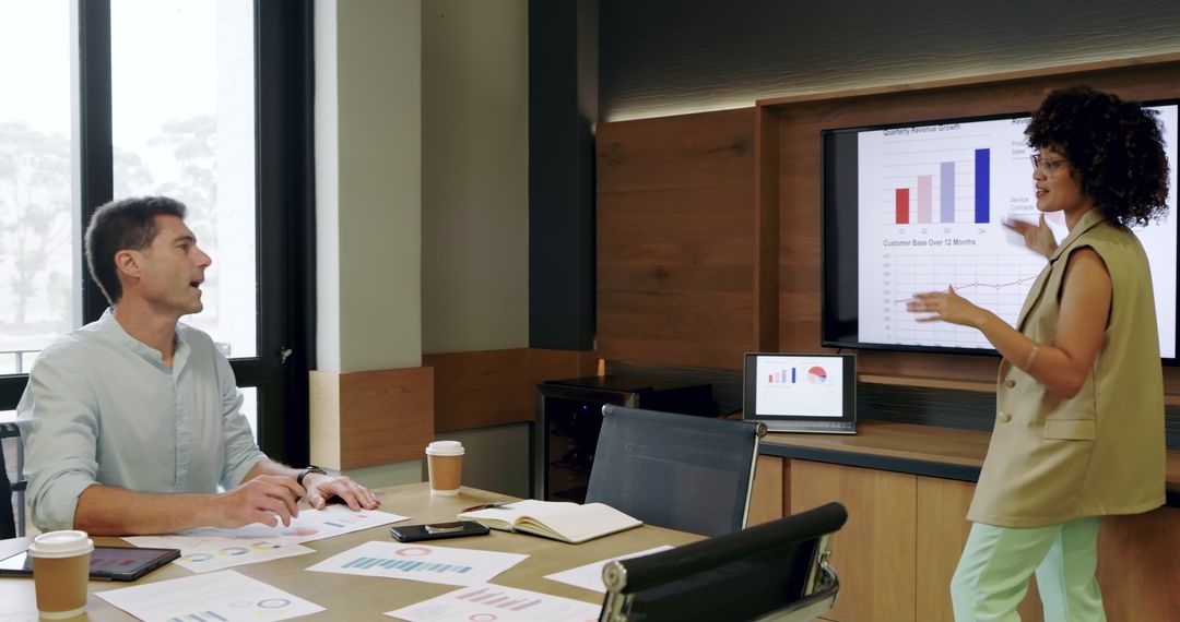 Diverse Professionals Collaborating on Data Analytics in Office Meeting