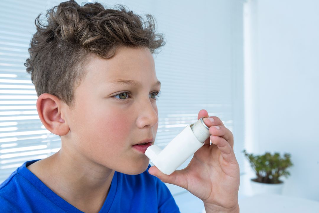 Young Boy Using Asthma Inhaler in Medical Clinic - Free Images, Stock Photos and Pictures on Pikwizard.com