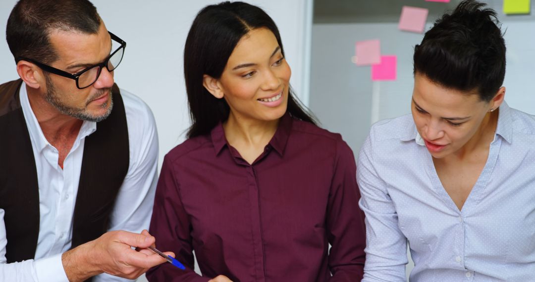 Diverse Business Team Collaborating Inside Office Setting During Daytime