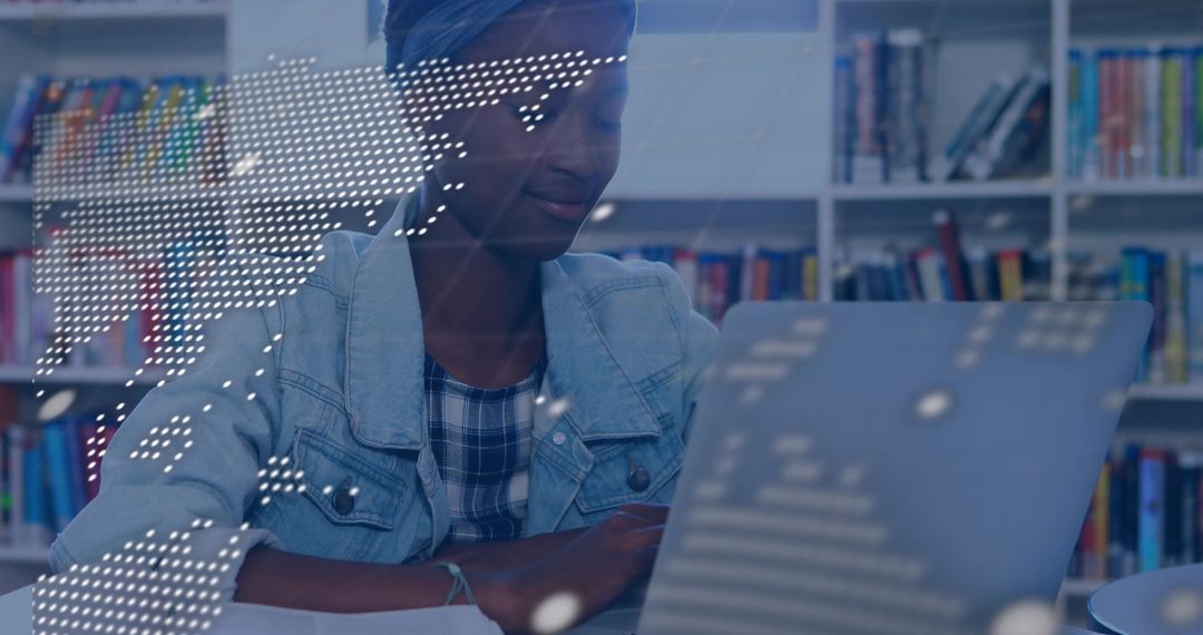 Teen studying with laptop in library with digital world map overlay for global learning