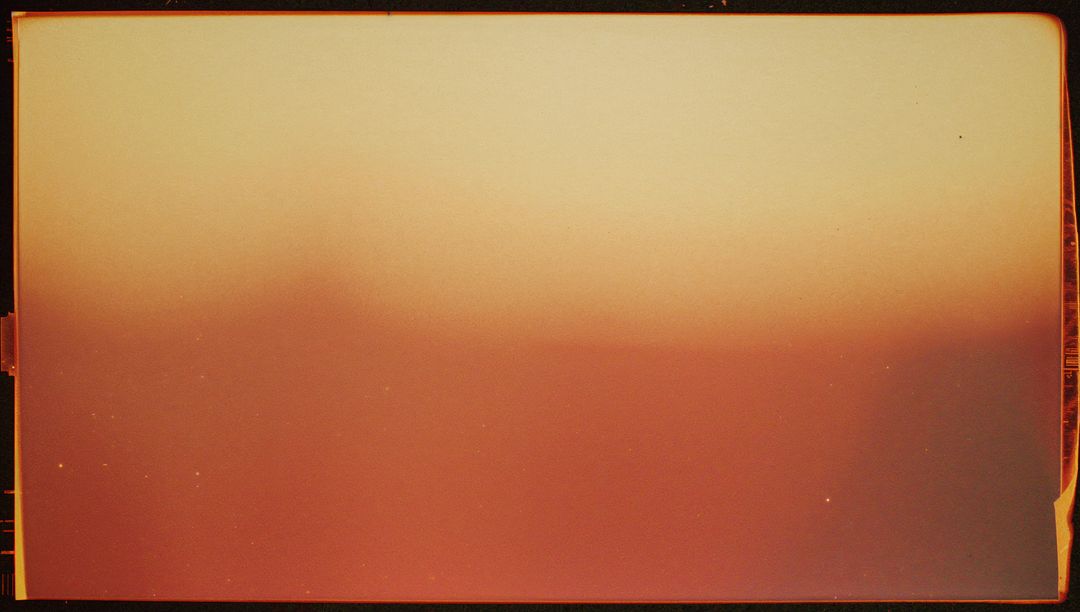Analog Film Frame with Light Leak and Warm Gradient, Vintage Grain and Border Artifacts
