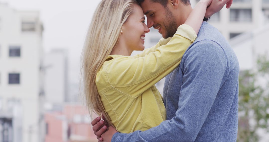 Caucasian Couple Embracing in Urban Environment